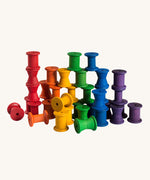 Grapat set of 36 wooden rainbow coloured spools. These wooden toys are part of a wide range of open ended toys available at Babipur.  