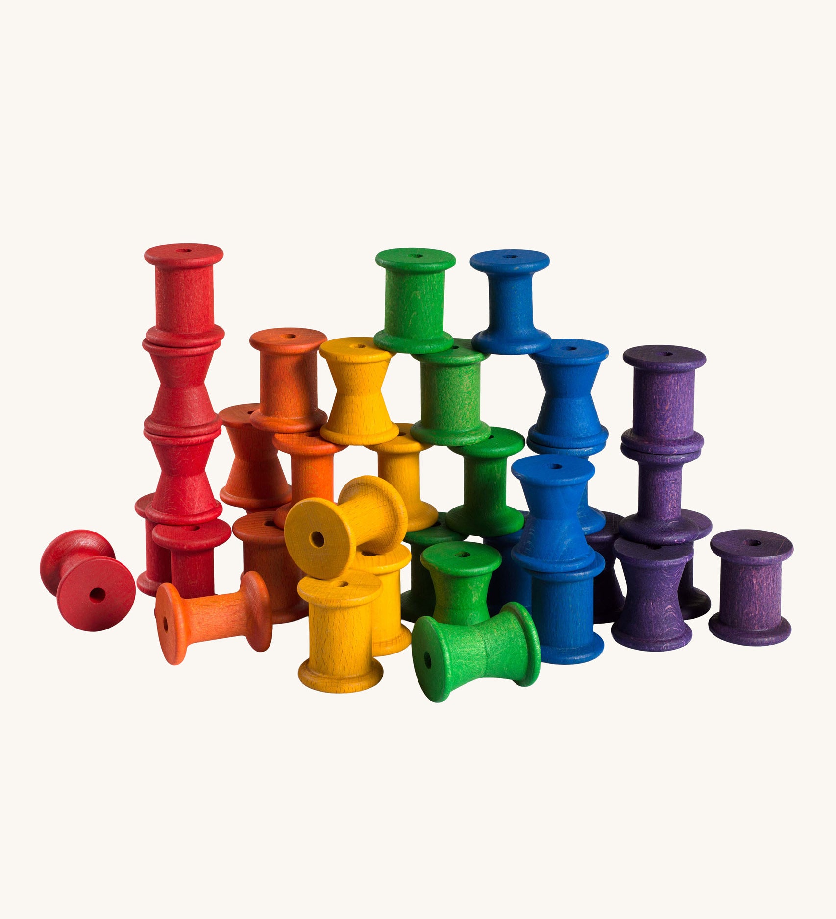 Grapat set of 36 wooden rainbow coloured spools. These wooden toys are part of a wide range of open ended toys available at Babipur.  
