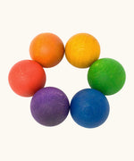 A set of 6 Grapat handcrafted wooden balls in rainbow inspired colours. Perfect for sorting games and creative play