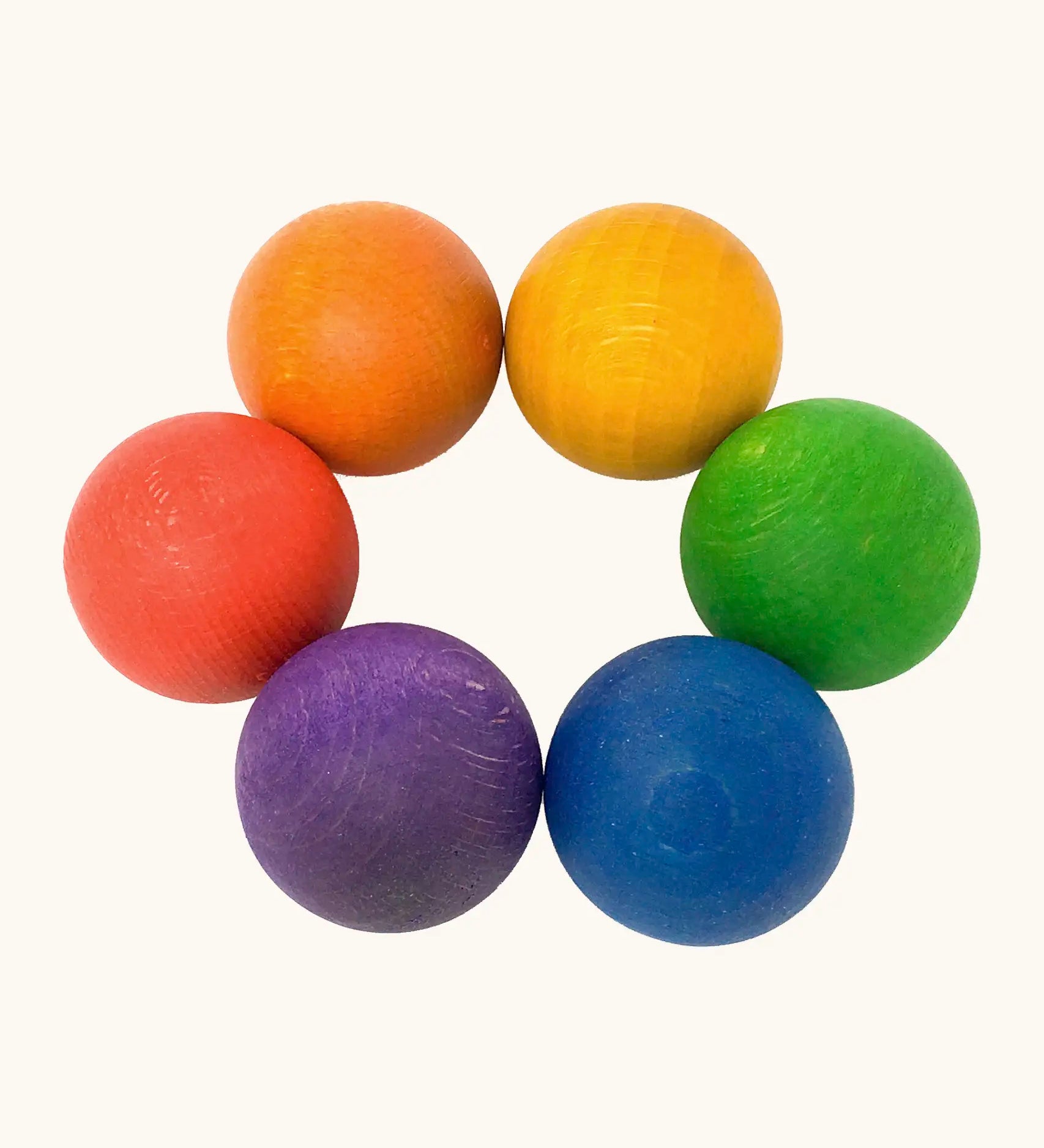 A set of 6 Grapat handcrafted wooden balls in rainbow inspired colours. Perfect for sorting games and creative play