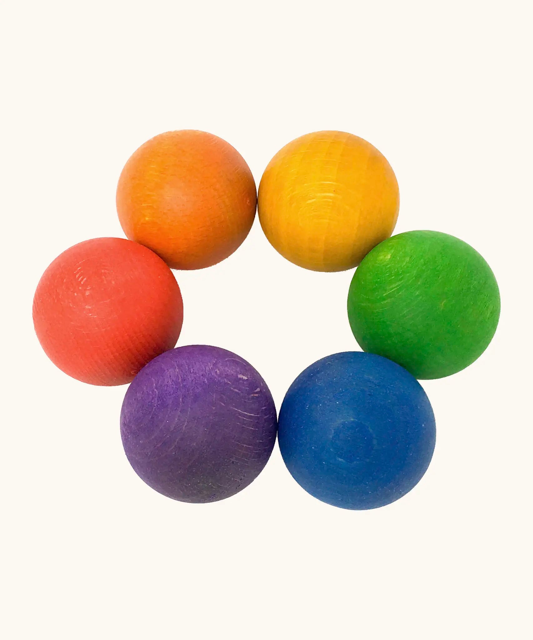 A set of 6 Grapat handcrafted wooden balls in rainbow inspired colours. Perfect for sorting games and creative play