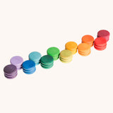 Grapat Loose Parts Rainbow Coins 12 Colours in a pack of 36 wooden coins with 3 of each of the 12 colours. Grapat have a wide range of wooden loose parts and toys available at Babipur. 