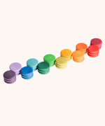 Grapat Loose Parts Rainbow Coins 12 Colours in a pack of 36 wooden coins with 3 of each of the 12 colours. Grapat have a wide range of wooden loose parts and toys available at Babipur. 