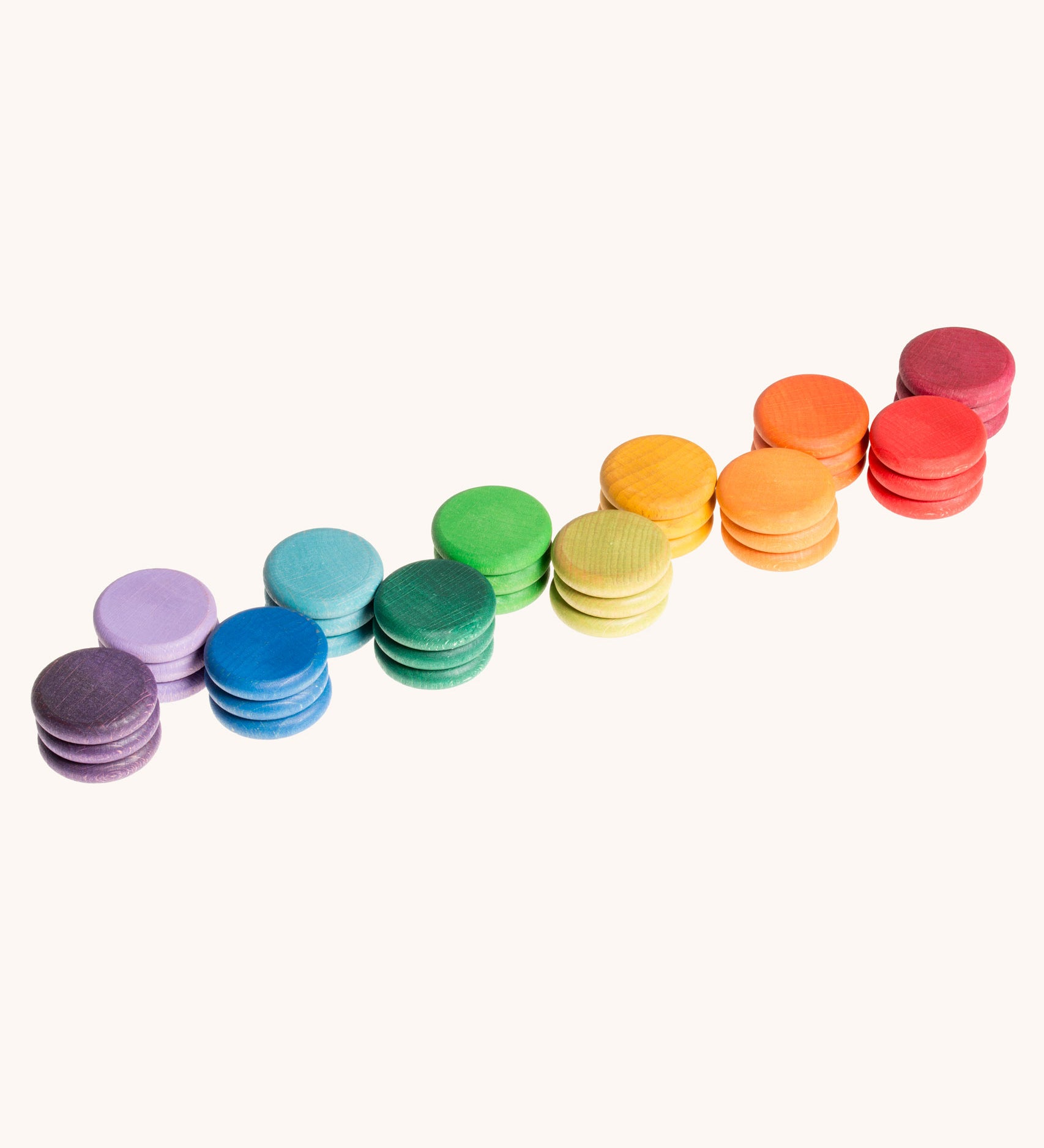 Grapat Loose Parts Rainbow Coins 12 Colours in a pack of 36 wooden coins with 3 of each of the 12 colours. Grapat have a wide range of wooden loose parts and toys available at Babipur. 