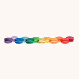 Grapat Loose Parts Rainbow Coins 12 Colours in a pack of 36 wooden coins with 3 of each of the 12 colours. Grapat have a wide range of wooden loose parts and toys available at Babipur. 