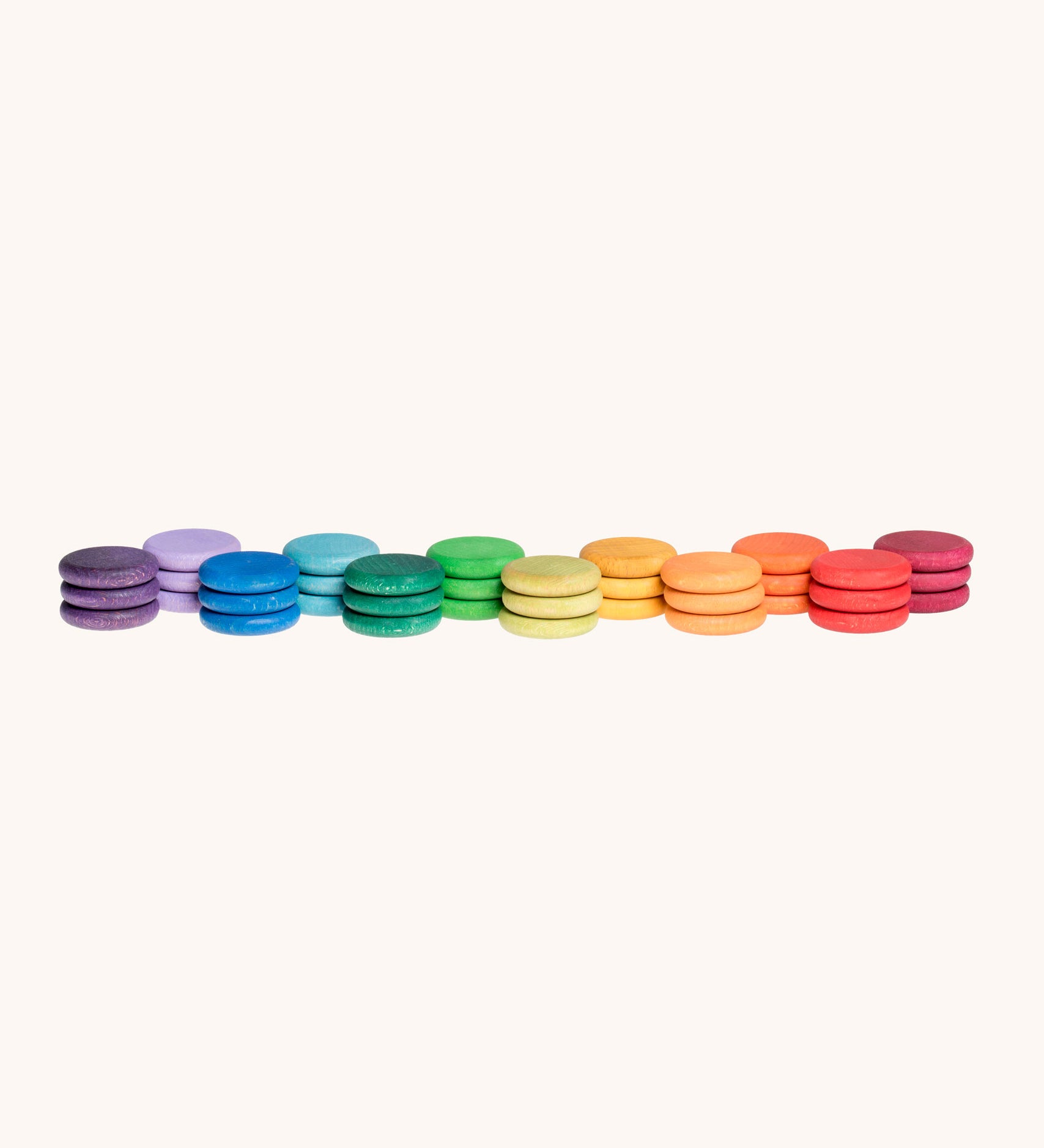Grapat Loose Parts Rainbow Coins 12 Colours in a pack of 36 wooden coins with 3 of each of the 12 colours. Grapat have a wide range of wooden loose parts and toys available at Babipur. 