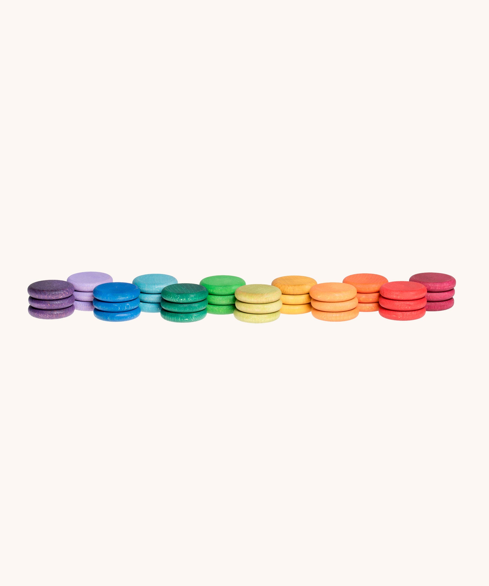 Grapat Loose Parts Rainbow Coins 12 Colours in a pack of 36 wooden coins with 3 of each of the 12 colours. Grapat have a wide range of wooden loose parts and toys available at Babipur. 