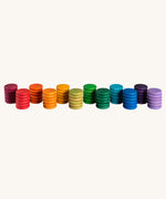 Grapat Loose Parts Rainbow Coins 12 Colours in a pack of 72 wooden coins with 6 of each of the 12 colours. Grapat have a wide range of wooden loose parts and toys available at Babipur. 