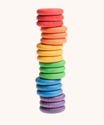 Grapat Loose Parts Rainbow Coins 6 Colours Supplementary Set in a pack of 18. The coins have all been stacked on top of each other. Grapat have a wide range of wooden loose parts and toys available at Babipur. 