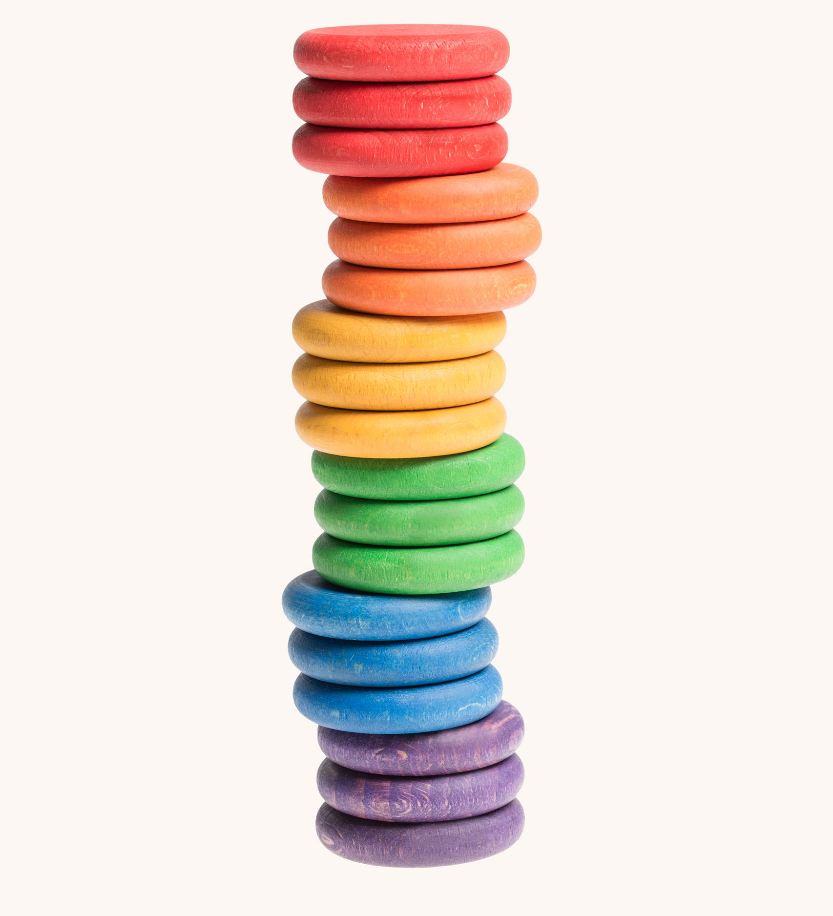 Grapat Loose Parts Rainbow Coins 6 Colours Supplementary Set in a pack of 18. The coins have all been stacked on top of each other. Grapat have a wide range of wooden loose parts and toys available at Babipur. 