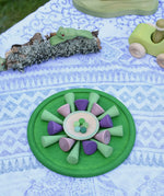 Mandala created with a green Grapat rainbow dish as a base.