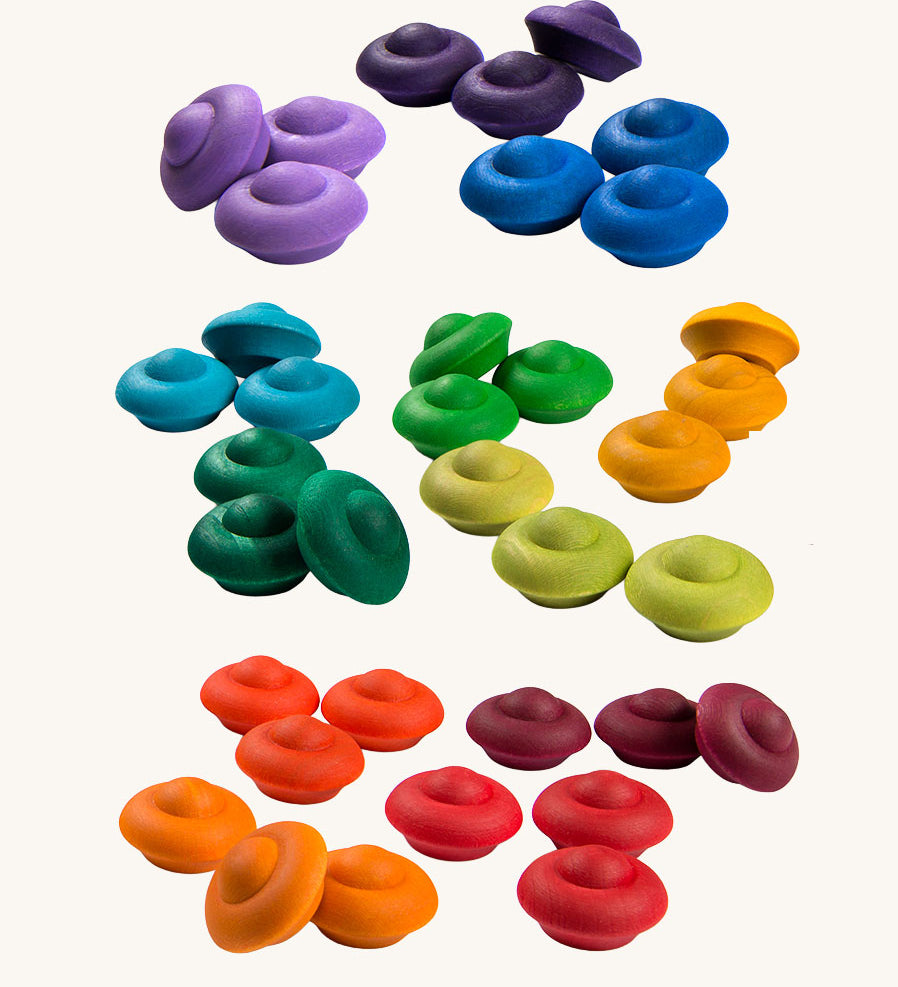 Grapat Rainbow Mandala Flowers. A set of 36 wooden pieces in rainbow colours, there are 3 in each colour. These wooden toys are part of a large range of loose parts available at Babipur. 