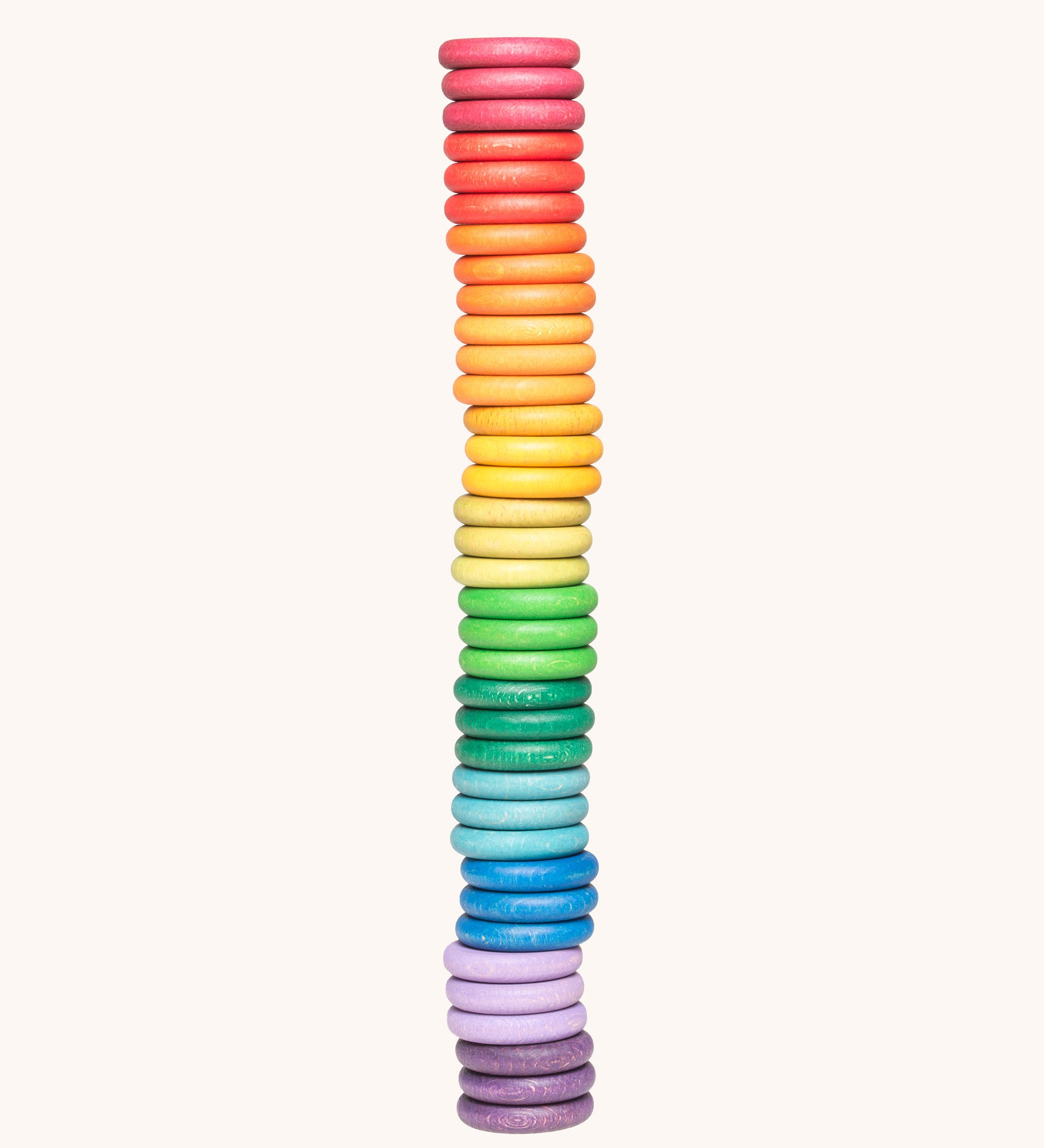 Grapat Loose Parts Rainbow Coins 12 Colours in a pack of 36 wooden coins with 3 of each of the 12 colours. Grapat have a wide range of wooden loose parts and toys available at Babipur. 