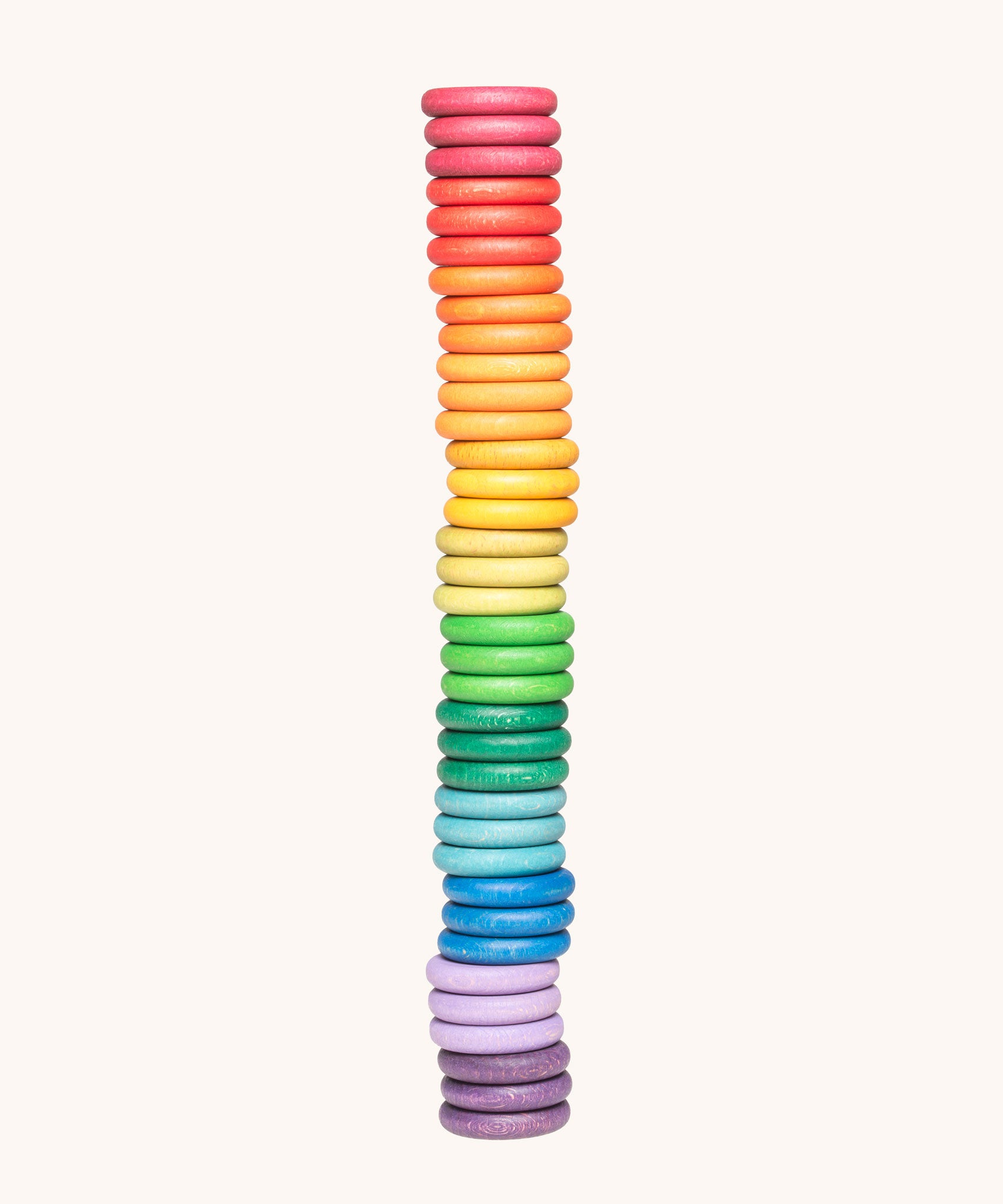 Grapat Loose Parts Rainbow Coins 12 Colours in a pack of 36 wooden coins with 3 of each of the 12 colours. Grapat have a wide range of wooden loose parts and toys available at Babipur. 