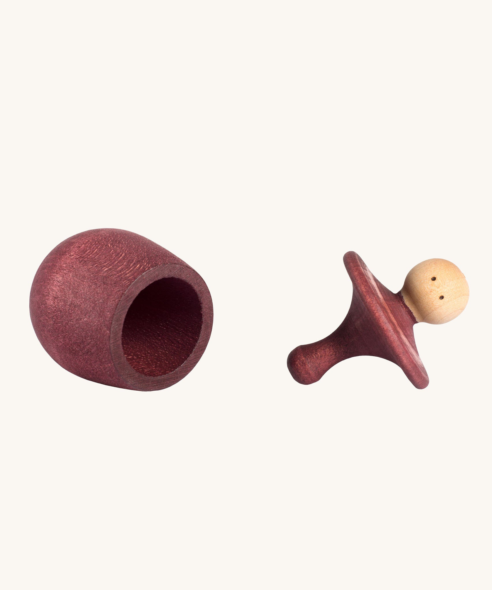 Grapat Red Little Things. A wooden top with eye drawn on and a red coloured pot to match. Grapat have a wide range of wooden toys and loose parts available at Babipur. 