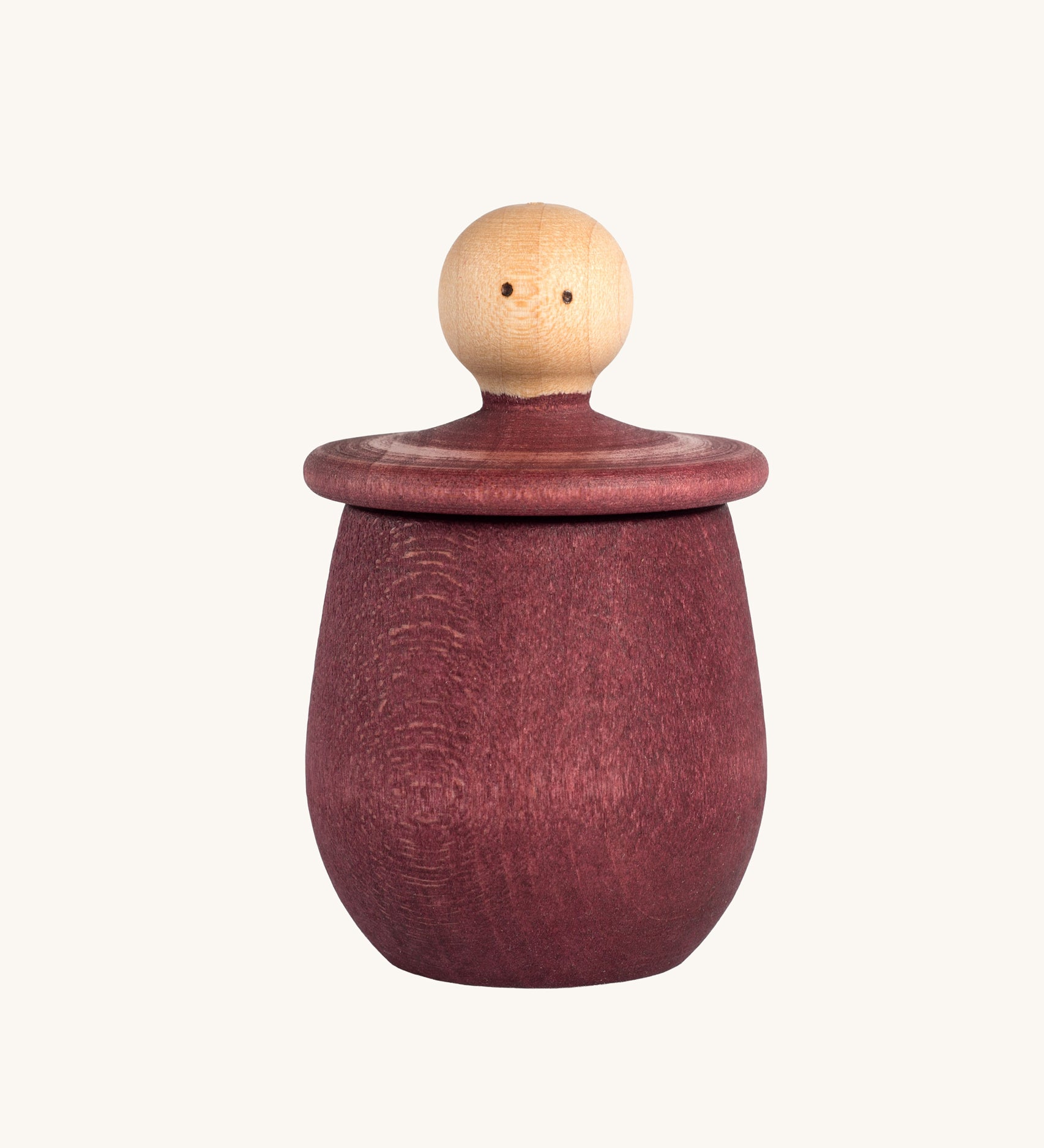 Grapat Red Little Things. A wooden top with eye drawn on and a red coloured pot to match. Grapat have a wide range of wooden toys and loose parts available at Babipur. 
