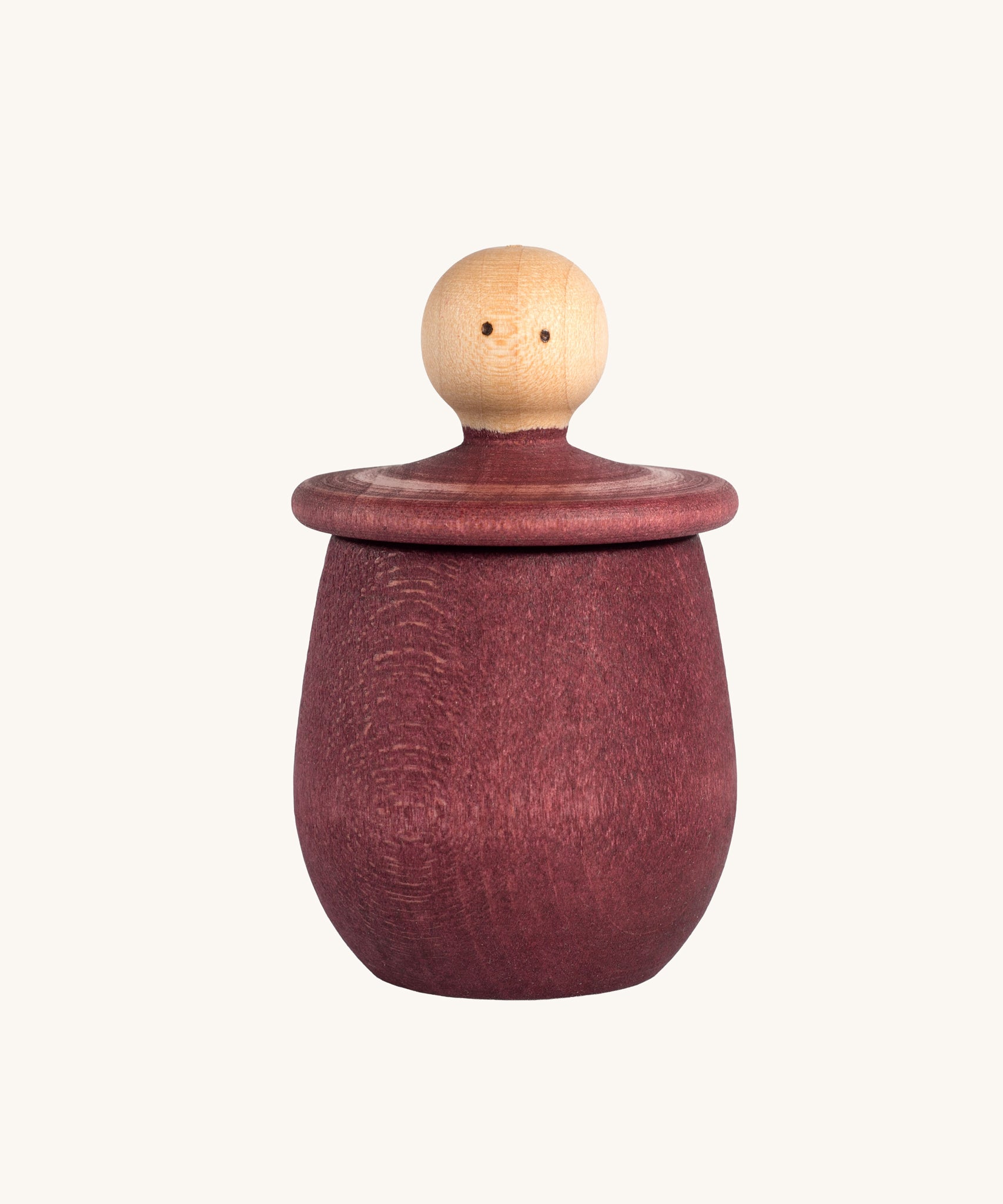 Grapat Red Little Things. A wooden top with eye drawn on and a red coloured pot to match. Grapat have a wide range of wooden toys and loose parts available at Babipur. 