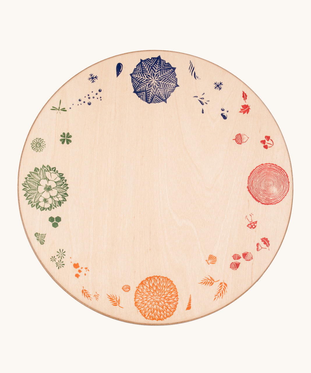 Grapat 4 Seasons and Elements Play Platform. A wooden circle shaped platform and stamped with elements and details to represent the four season. These handcrafted items from Grapat are part of a wide range of wooden toys available here at Babipur.