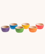 Grapat 6 Rainbow Sorting Bowls lined up. These wooden bowls are part of a wide range of loose parts and wooden toys available here at Babipur. 