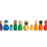 12 Grapat Together wooden figures lined up in a row on a white background.