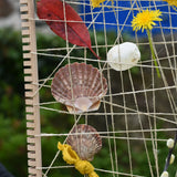 Close up of the Grapat weaving frame filled with natural materials. 