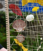 Close up of the Grapat weaving frame filled with natural materials. 
