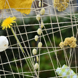 Close up of natural materials placed into the Grapat weaving frame.