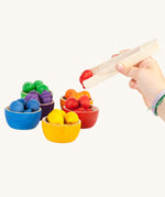 Grapat Wooden Toy Bowls and  Acorns Set. A set of 6 coloured bowls with wooden acorn shapes in matching pieces and wooden tongs. These wooden toys are part of a wide range of open ended toys available at Babipur.  