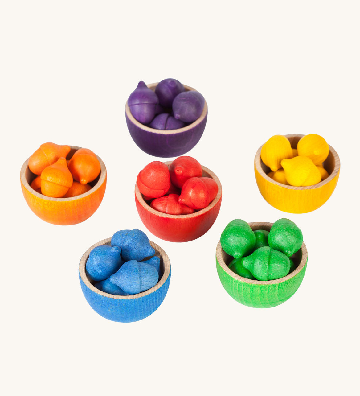 Grapat Wooden Toy Bowls and  Acorns Set. A set of 6 coloured bowls with wooden acorn shapes in matching pieces. These wooden toys are part of a wide range of open ended toys available at Babipur.  