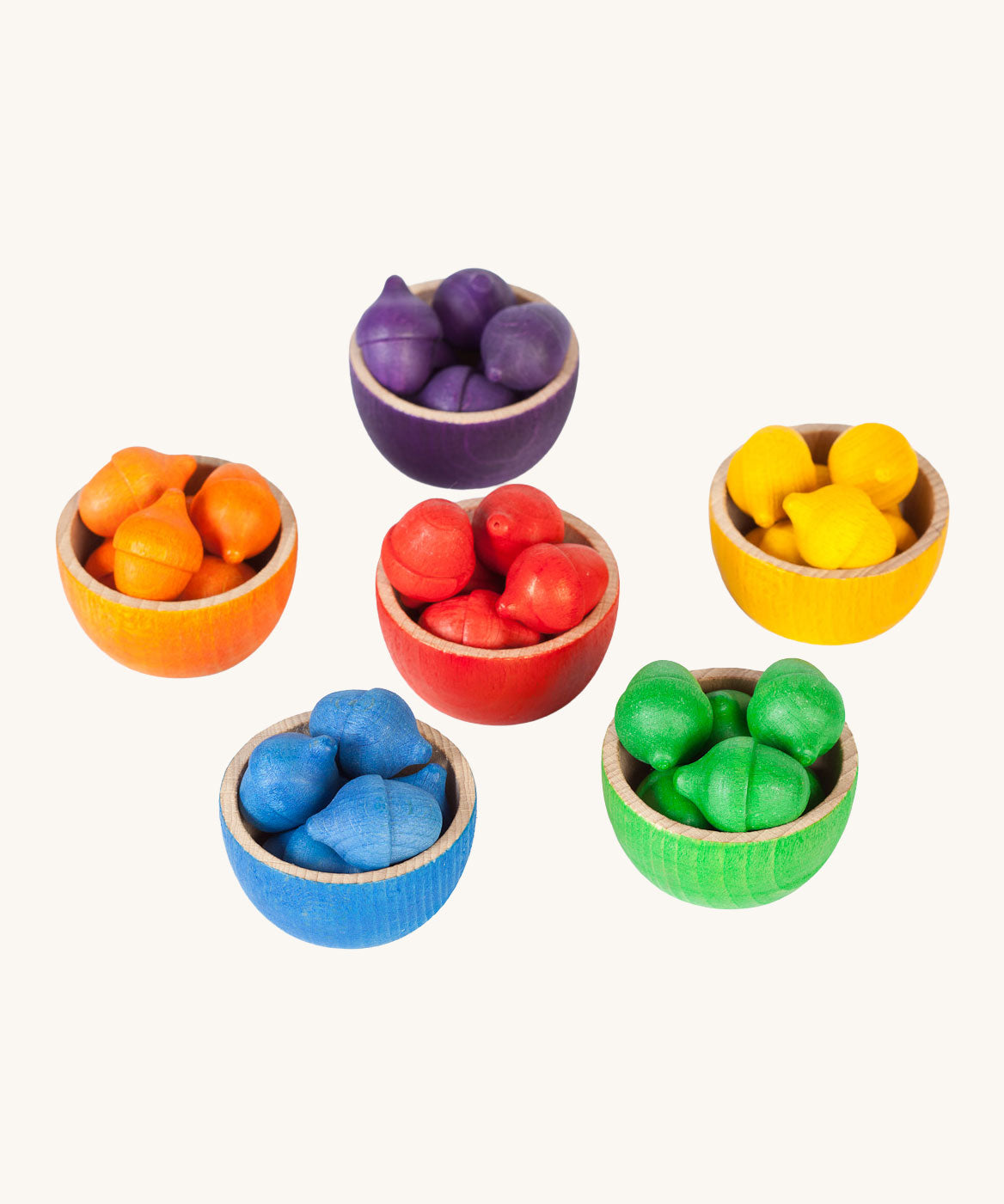 Grapat Wooden Toy Bowls and  Acorns Set. A set of 6 coloured bowls with wooden acorn shapes in matching pieces. These wooden toys are part of a wide range of open ended toys available at Babipur.  