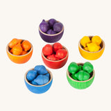 Grapat Wooden Toy Bowls and  Acorns Set. A set of 6 coloured bowls with wooden acorn shapes in matching pieces. These wooden toys are part of a wide range of open ended toys available at Babipur.  