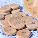 Grapat wooden counting number coins. Natural wooden coins with numbers drawn on. 