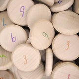 Close up the Grapat 60 wooden counting coins. 