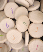 Close up the Grapat 60 wooden counting coins. 