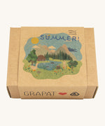 A close up of the decorative cardboard box that holds the Hello Summer themed wooden pieces showing a delicate  alpine themed print. 