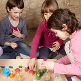 Children creating a small world using the Grapat freeplay tray, peg dolls and various small pieces