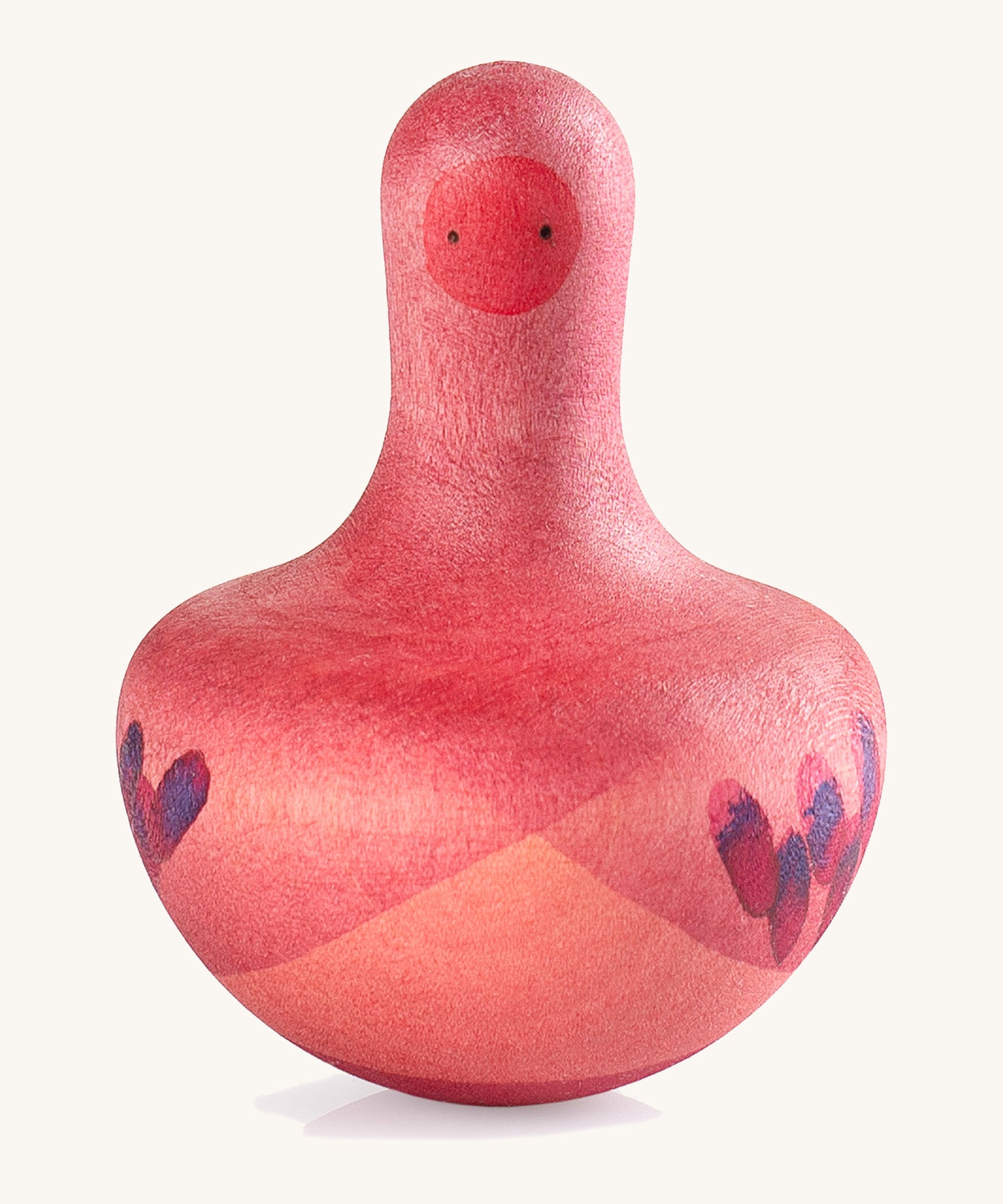 Grapat pink flowing bird - A vibrant tactile wooden pink wobbly bird with hand painted small face with a hand painted contrast purple feather detailing