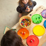 Children's creative play using the Grapat wooden rainbow dishes and various small items