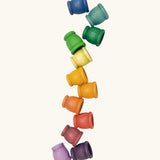 A set of 12 small handcrafted wooden Grapat curved cups in rainbow inspired colours