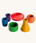 Grapat Wooden Rainbow Sorting Pots. Wooden pots in a mix of shapes in different colours.