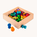 The Grapat square shaped Wooden Storage Box filled with rainbow coloured mushroom shaped Grapat mandala pieces. .