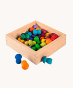 The Grapat square shaped Wooden Storage Box filled with rainbow coloured mushroom shaped Grapat mandala pieces. .