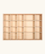 An empty Grapat wooden tinker tray showing different sized compartments for loose pieces