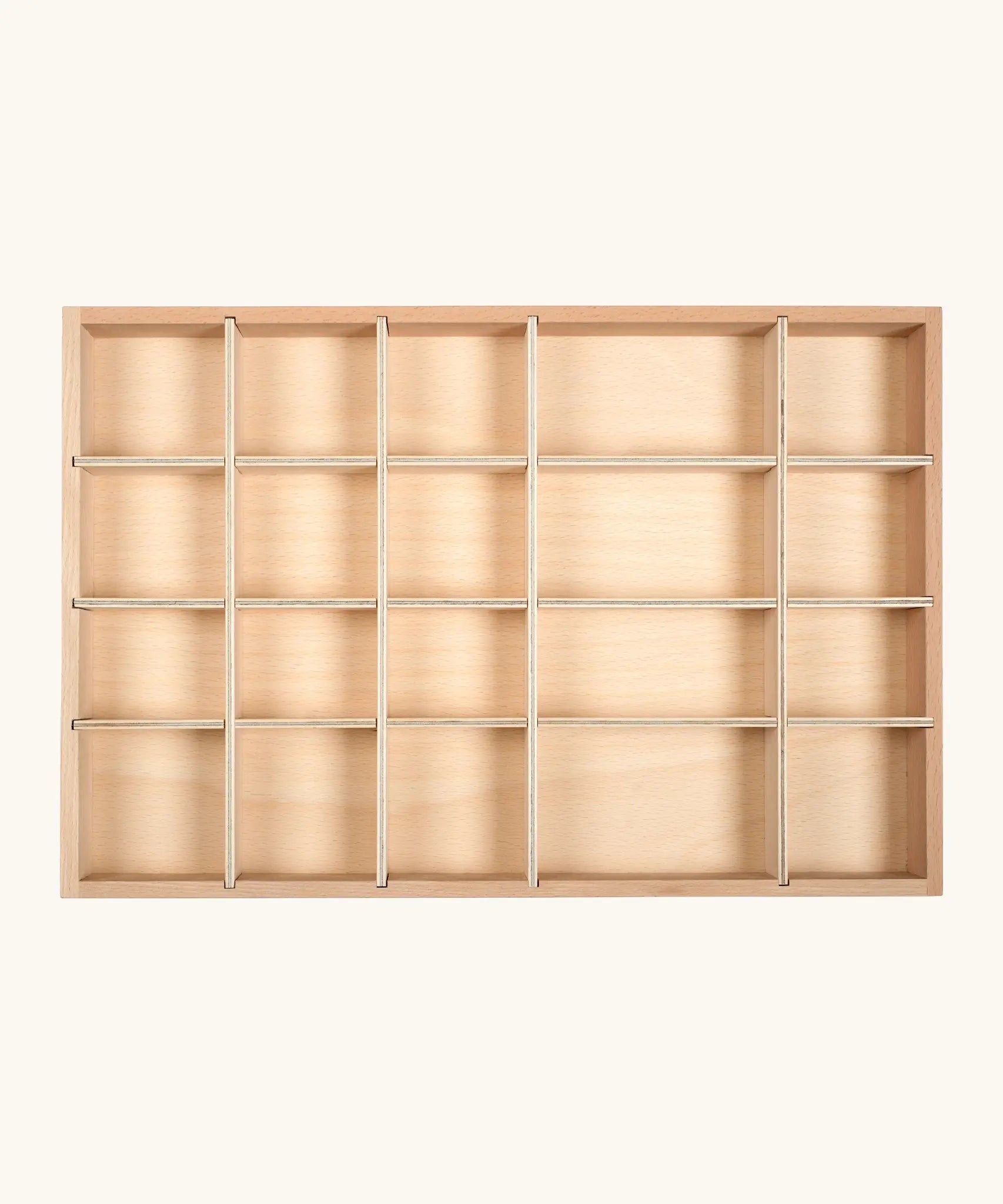 An empty Grapat wooden tinker tray showing different sized compartments for loose pieces