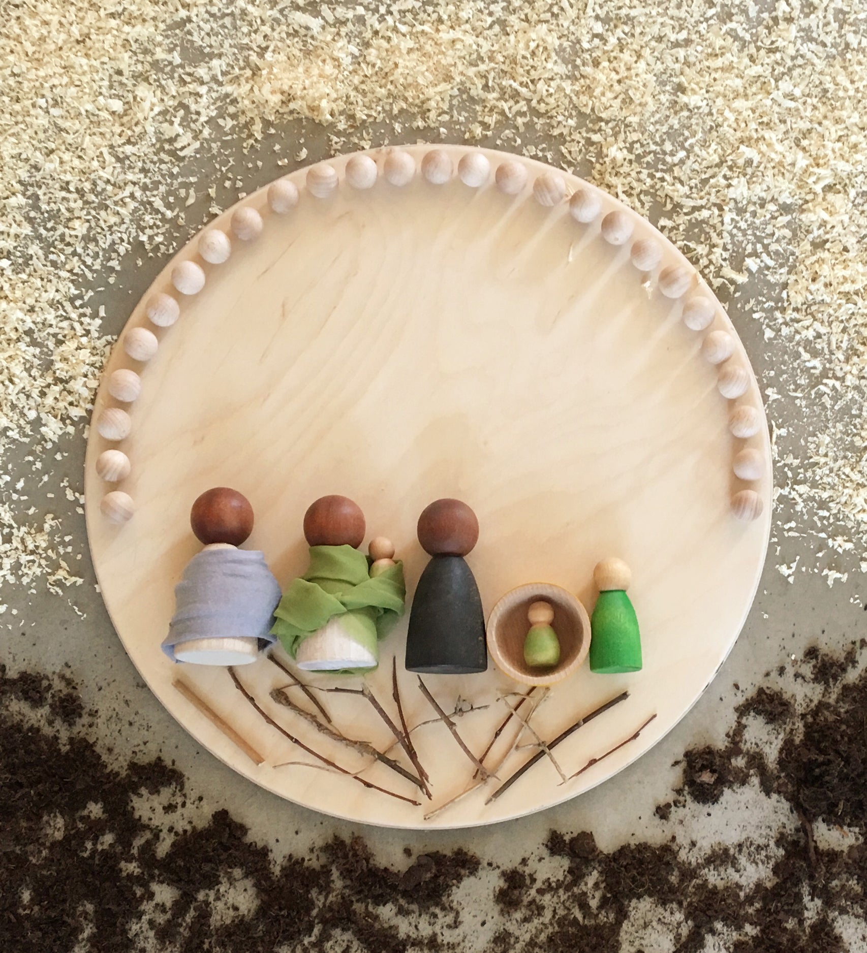 The Grapat wooden toy Construction Platform in use with toys placed on it. Grapat have a wide range of wooden toys and loose parts available at Babipur. 