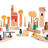 Grapat plastic-free Happy Place toy blocks set laid out on a white background with some Grapat Nins (not included in the set)