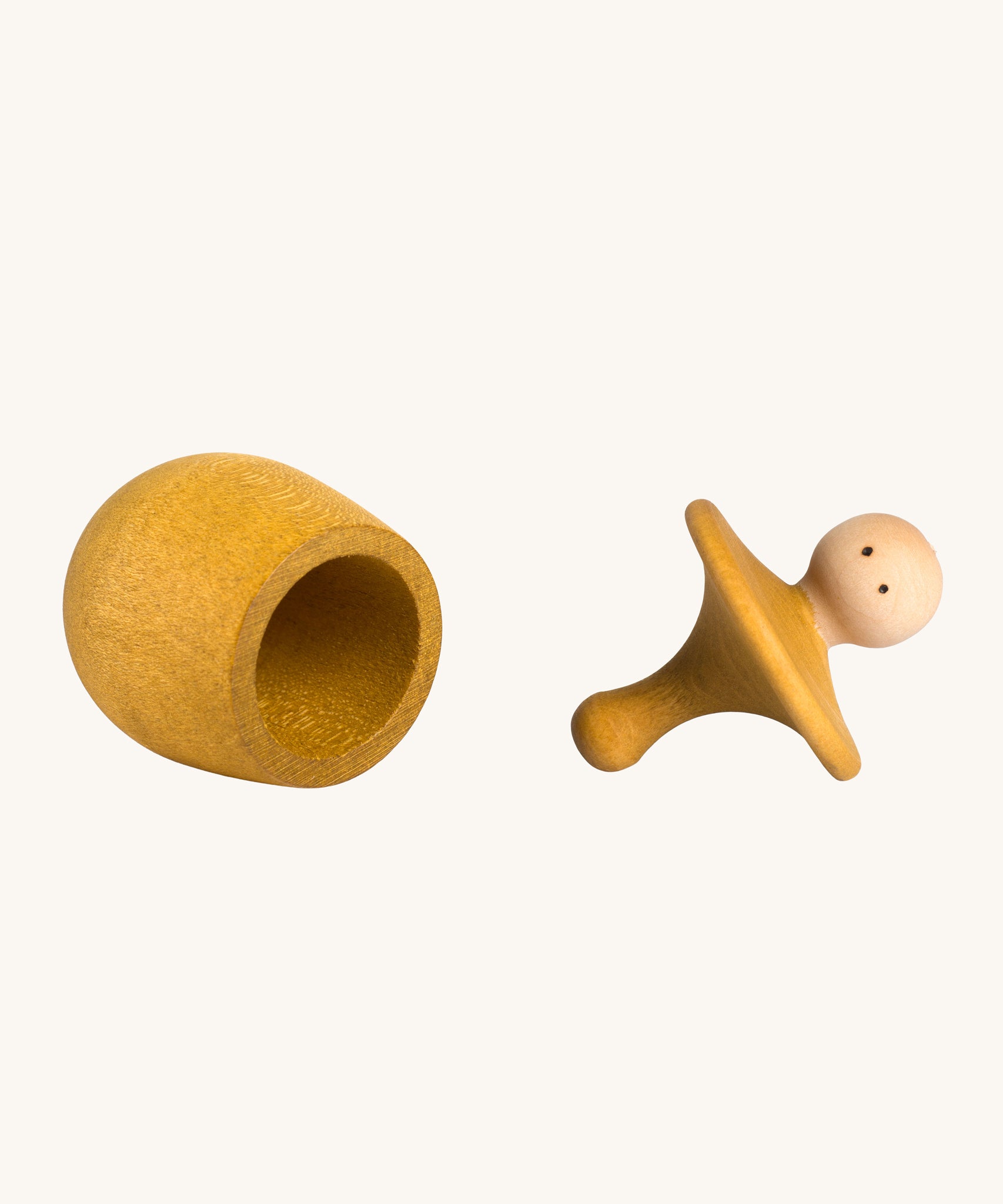 Grapat yellow Little Things. A wooden top with eyes drawn on and a yellow coloured pot to match. Grapat have a wide range of wooden toys and loose parts available at Babipur. 