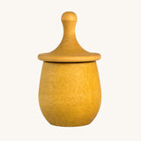 Grapat yellow Little Things. A wooden top with eyes drawn on and a yellow coloured pot to match. Grapat have a wide range of wooden toys and loose parts available at Babipur. 