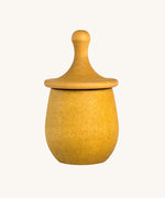 Grapat yellow Little Things. A wooden top with eyes drawn on and a yellow coloured pot to match. Grapat have a wide range of wooden toys and loose parts available at Babipur. 