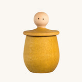Grapat yellow Little Things. A wooden top with eyes drawn on and a yellow coloured pot to match. Grapat have a wide range of wooden toys and loose parts available at Babipur. 